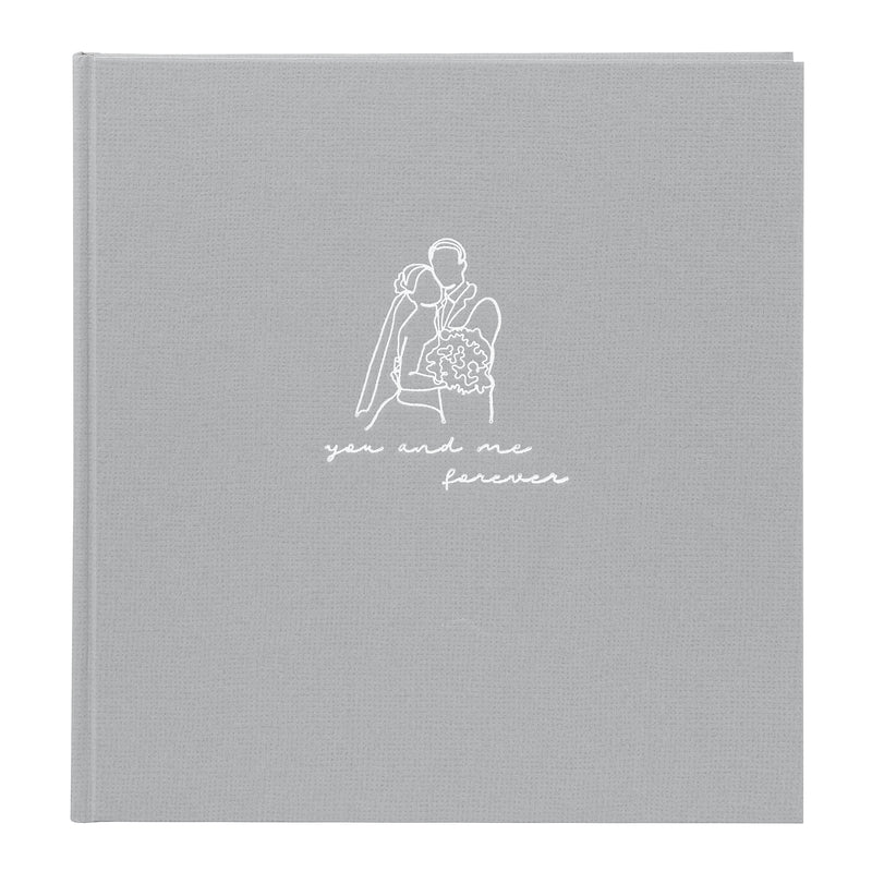 A grey Goldbuch photo album with an illustration of a man and a woman on its front cover.