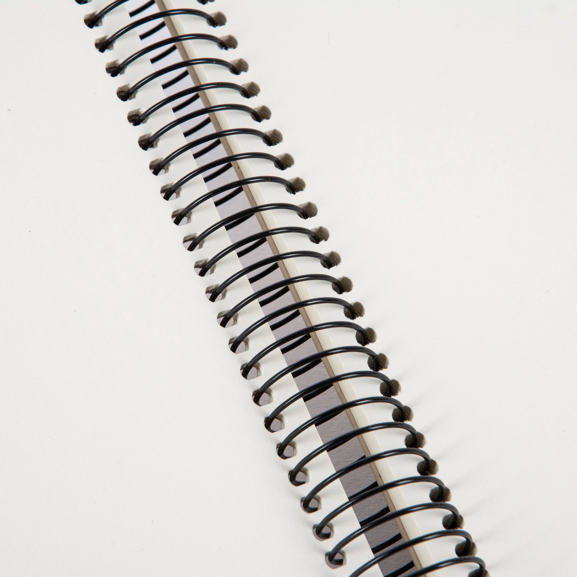 A Goldbuch clean design grey photo album with a spiral binding.