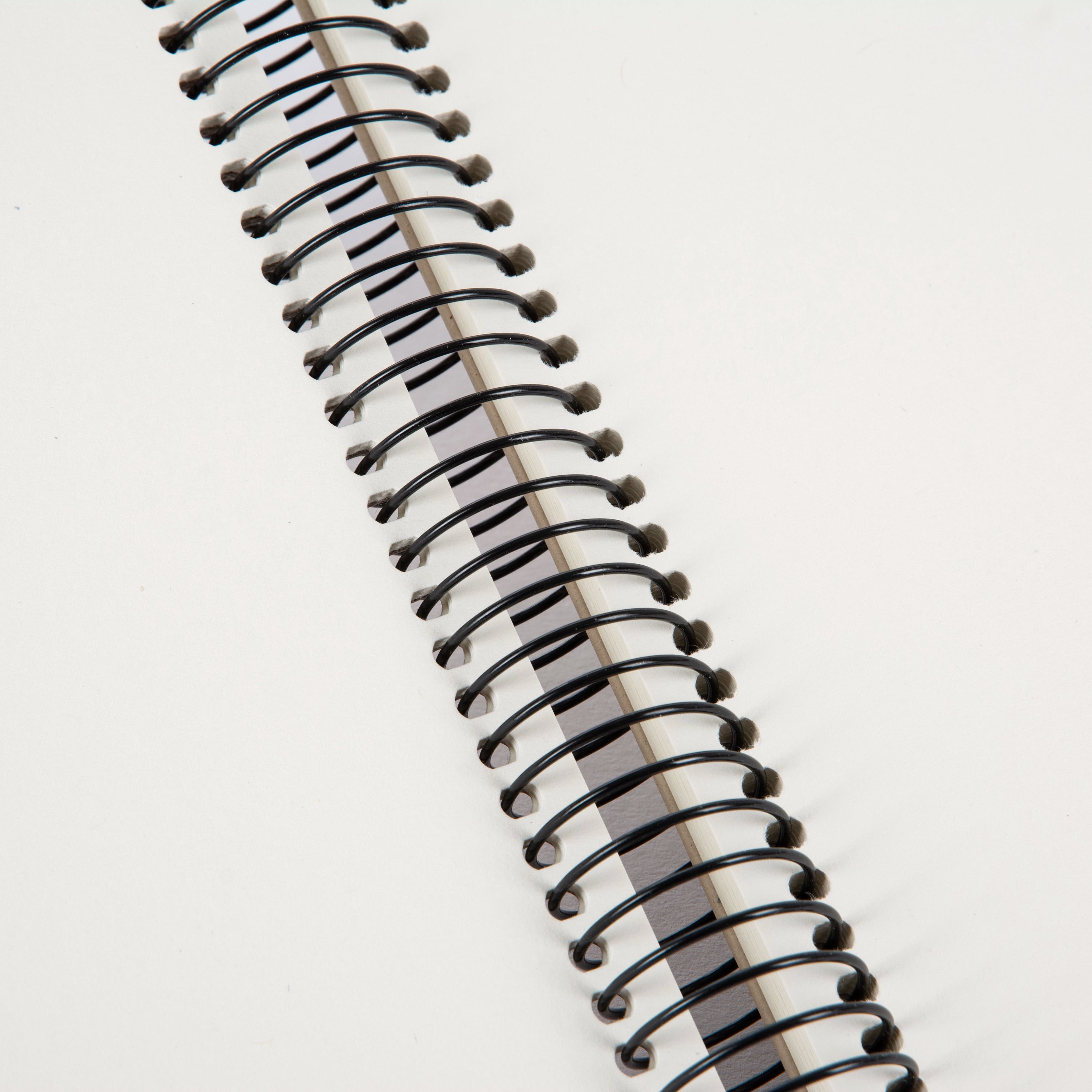 A Goldbuch clean design grey photo album with a spiral binding.