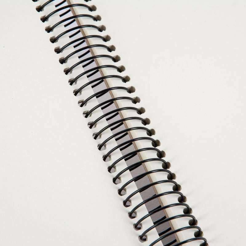 A Goldbuch clean design grey photo album with a spiral binding.
