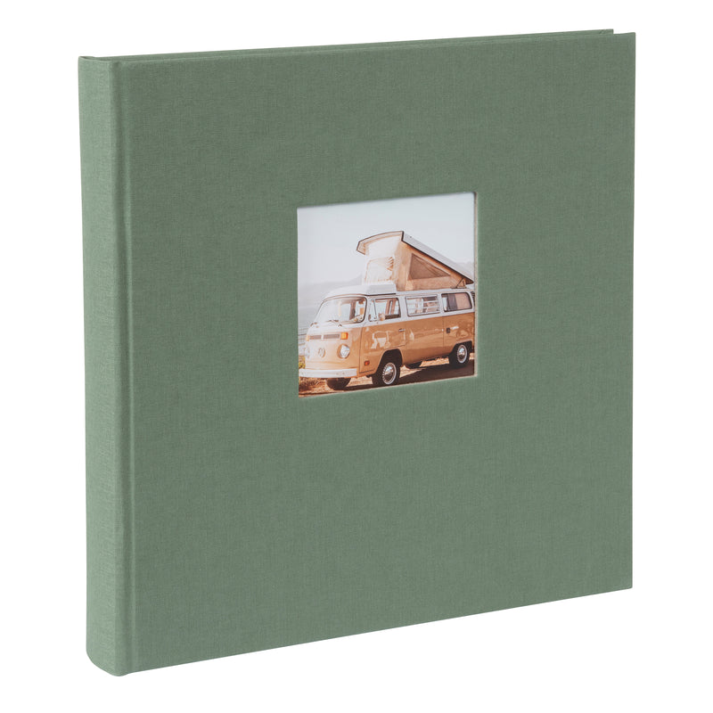 A Goldbuch artichoke green photo album with a cover illustration of a van with a tent on the roof, showcasing its hardcover design and black pages.