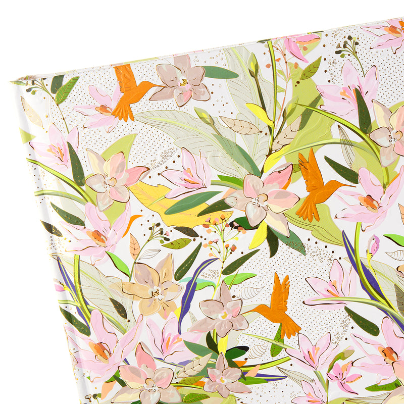 A Goldbuch floral patterned photo album featuring colorful birds and flowers.
