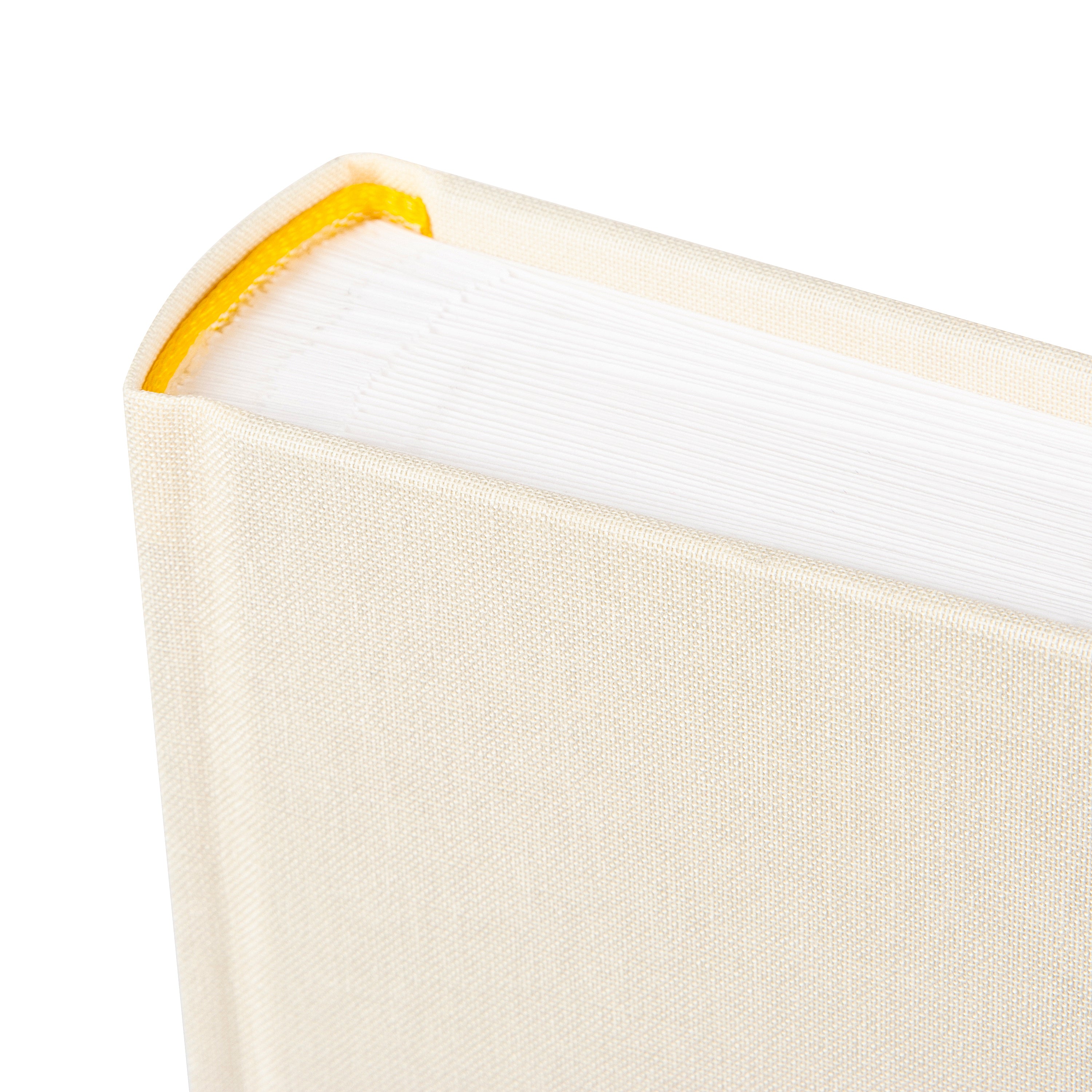 A Goldbuch photo album with three photographs showcased on its surface.