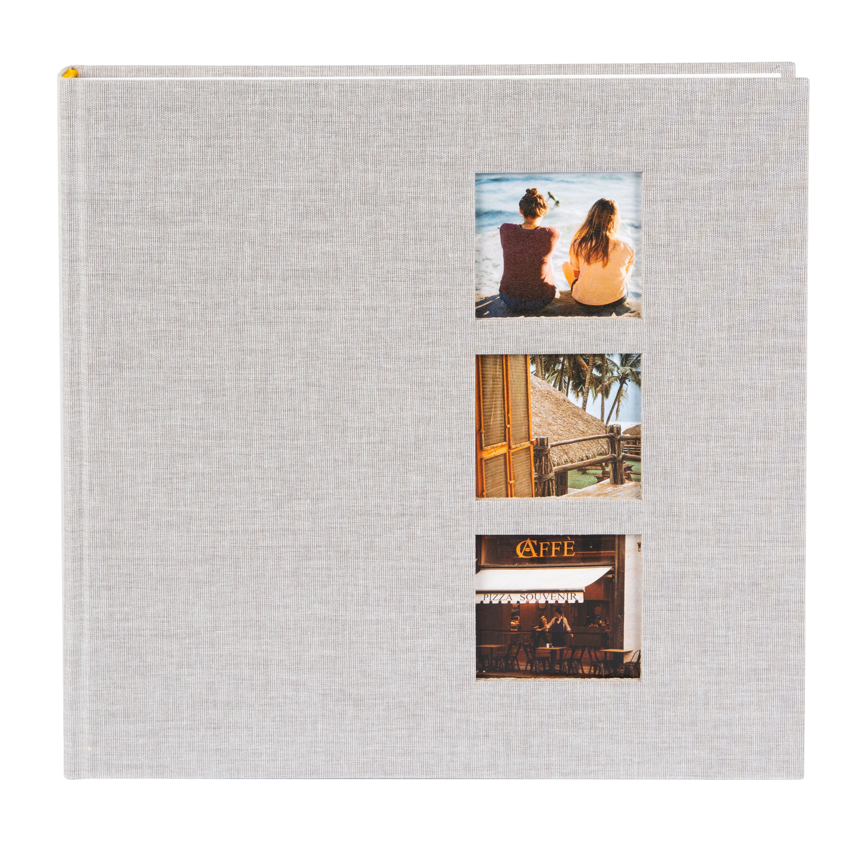 A grey Goldbuch photo album with three photographs showcased on its surface.