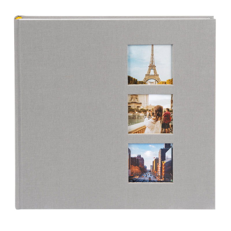 Grey Goldbuch photo album with cut-out sections displaying images of the Eiffel Tower and other scenes.