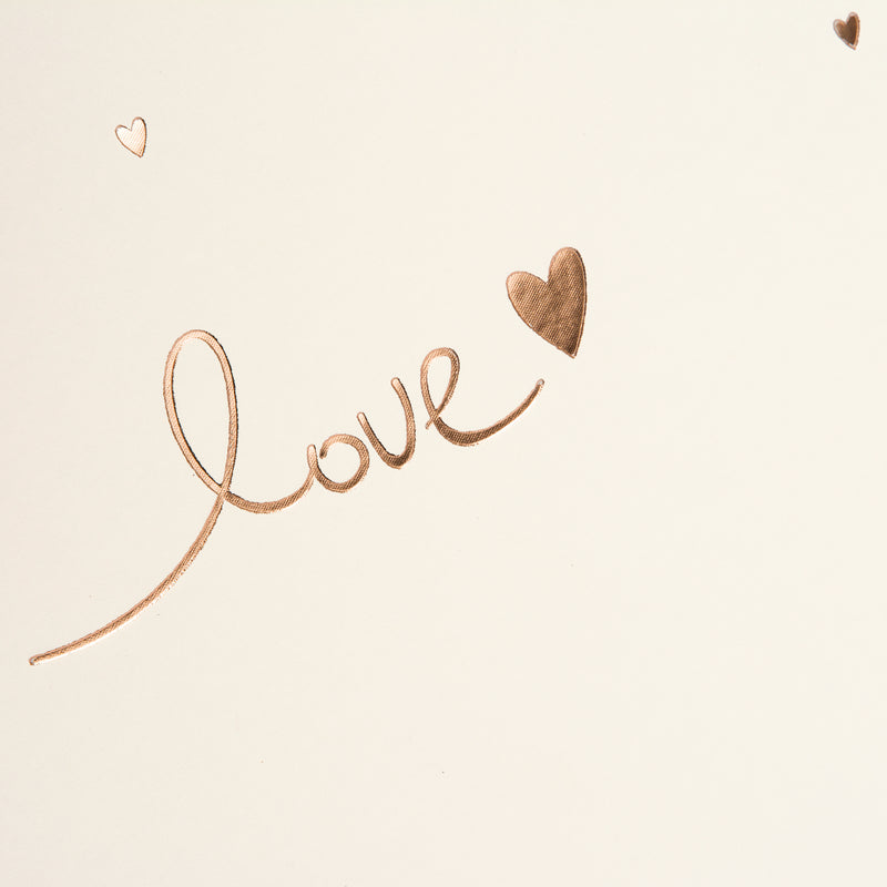 Goldbuch photo album with 'love' and heart design on a beige background