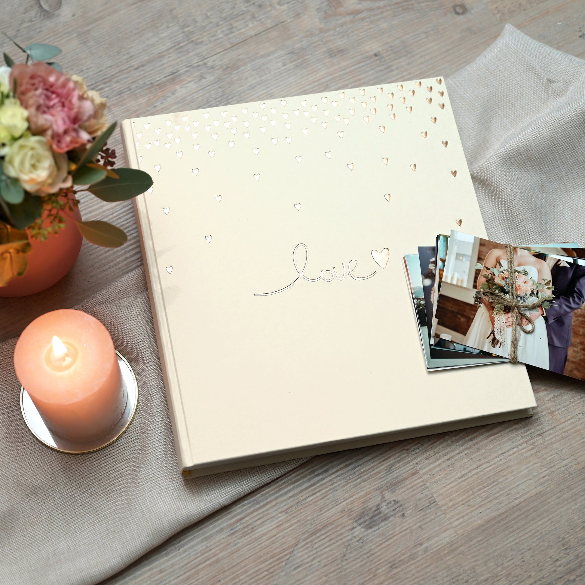 Goldbuch photo album with 'love' and heart design on a beige background