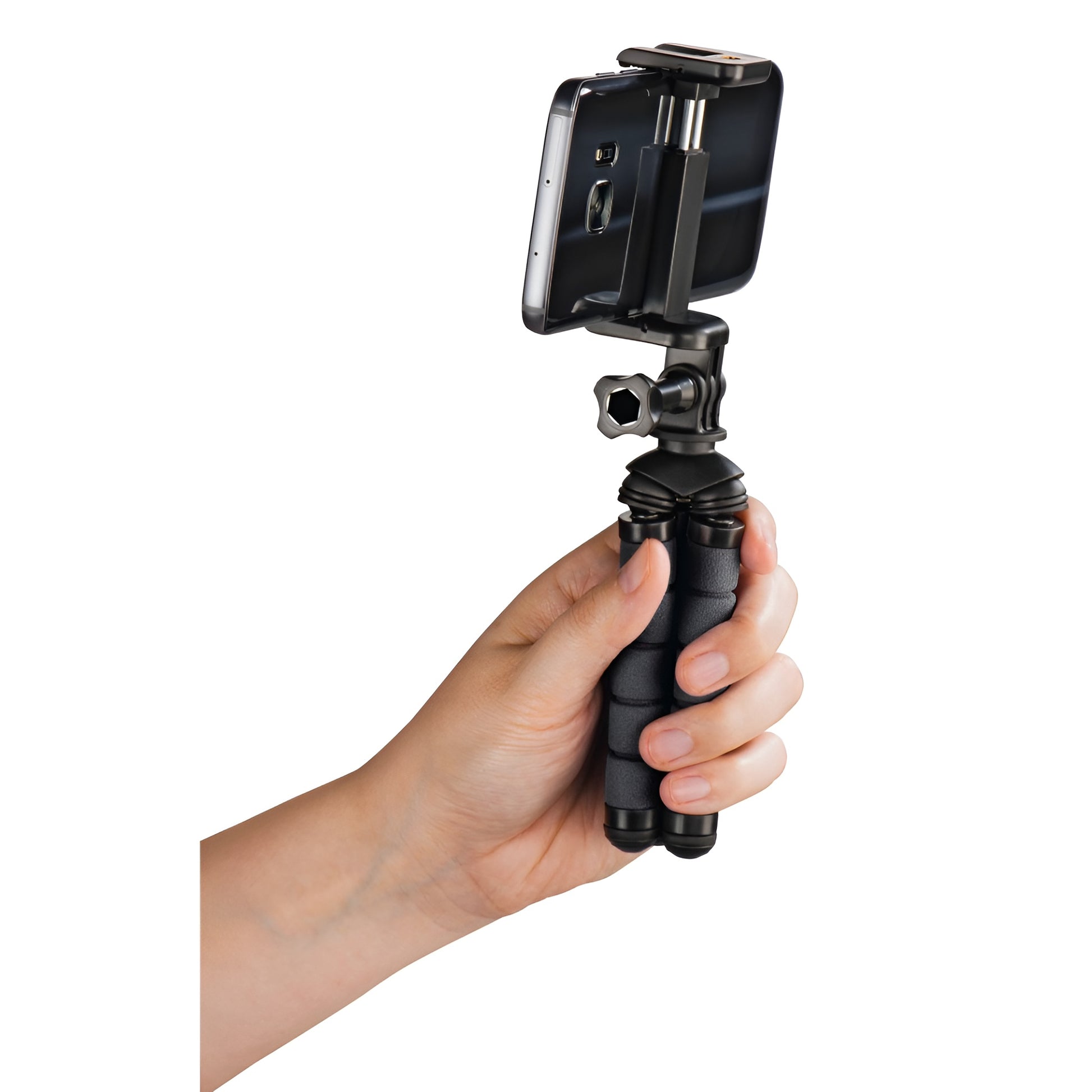 A Hama tripod supporting a camera, positioned for photography, showcasing stability and professional equipment.
