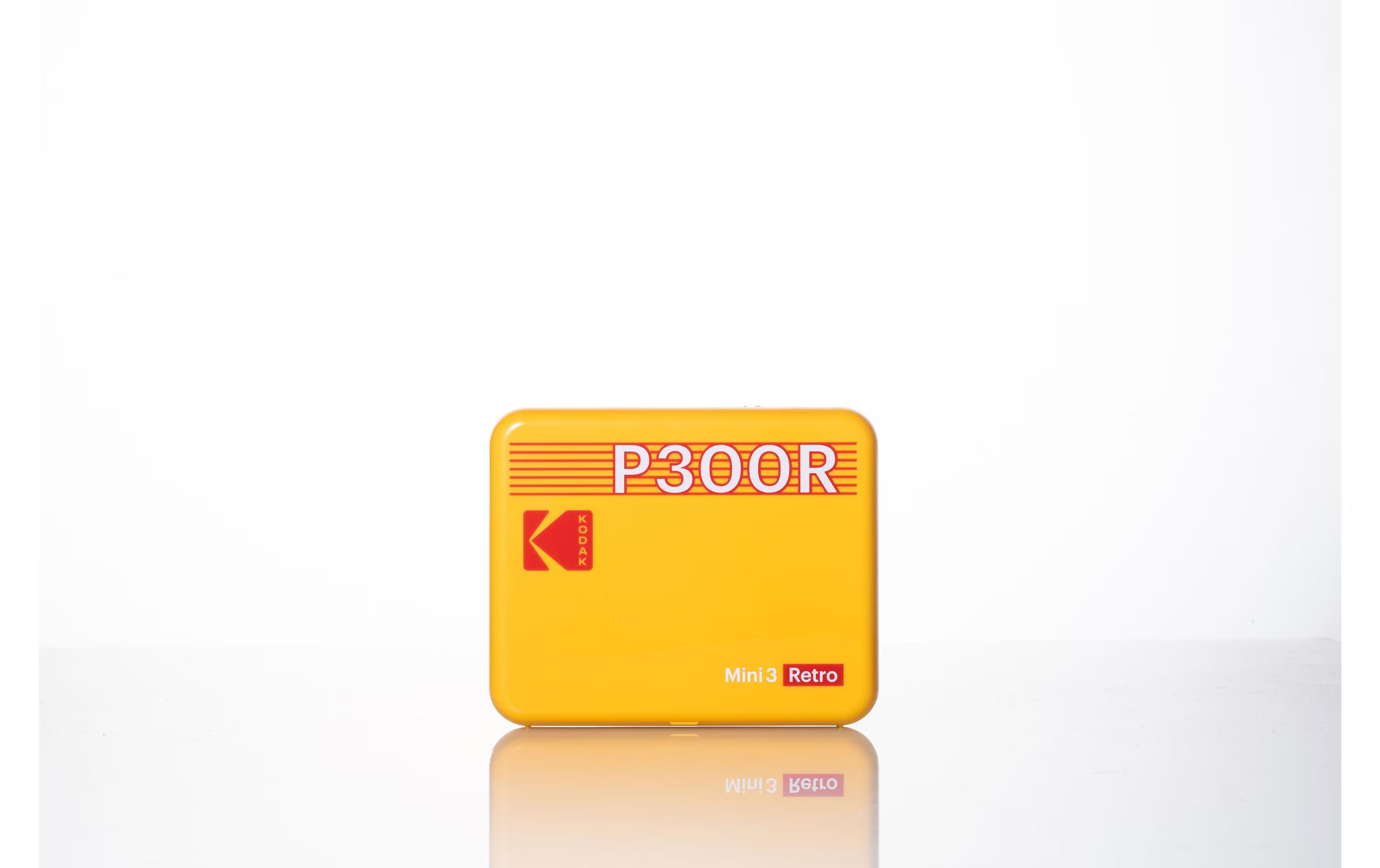 A yellow Kodak portable photo printer with retro design.