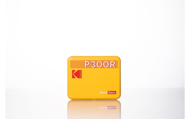 A yellow Kodak portable photo printer with retro design.