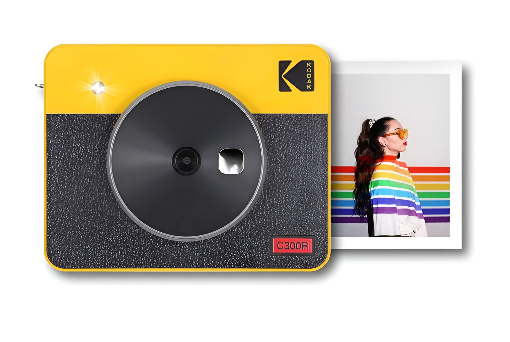 A yellow and black Kodak instant camera displaying a photo during the printing procedure.