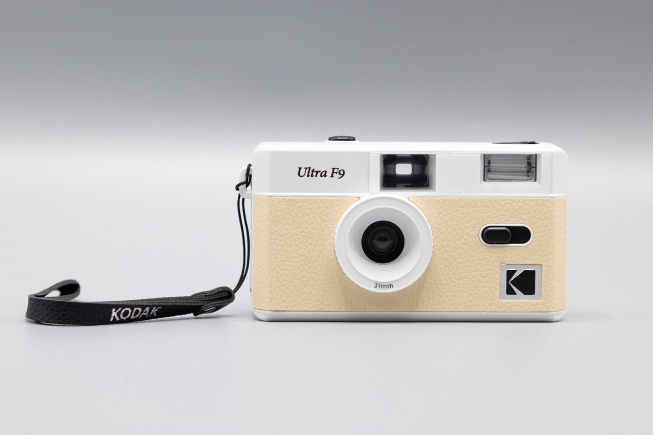 Beige and white Kodak Ultra F9 camera on a white background
