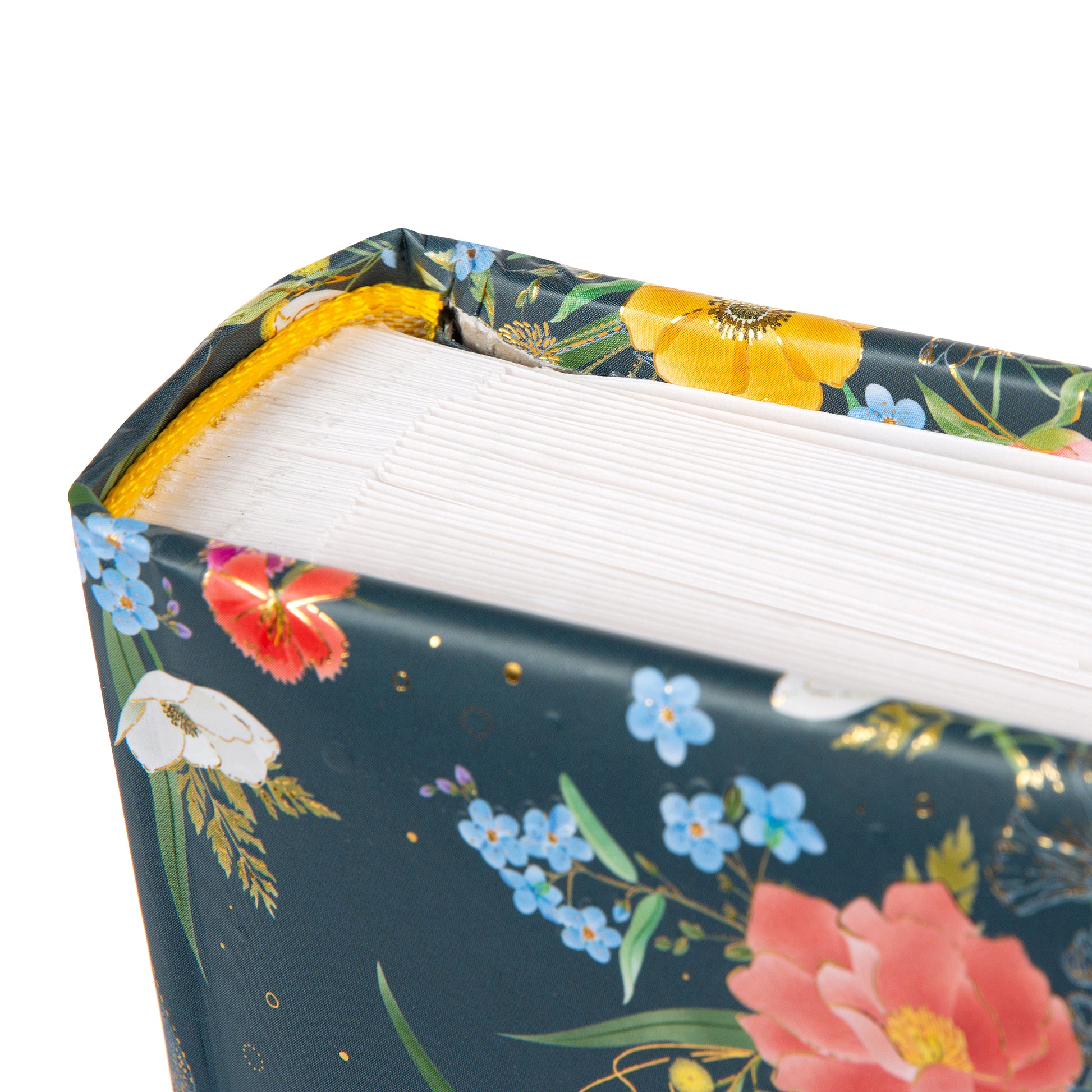 A Goldbuch photo album with a flower illustration on a dark cover, showcasing its hardcover design and white pages.