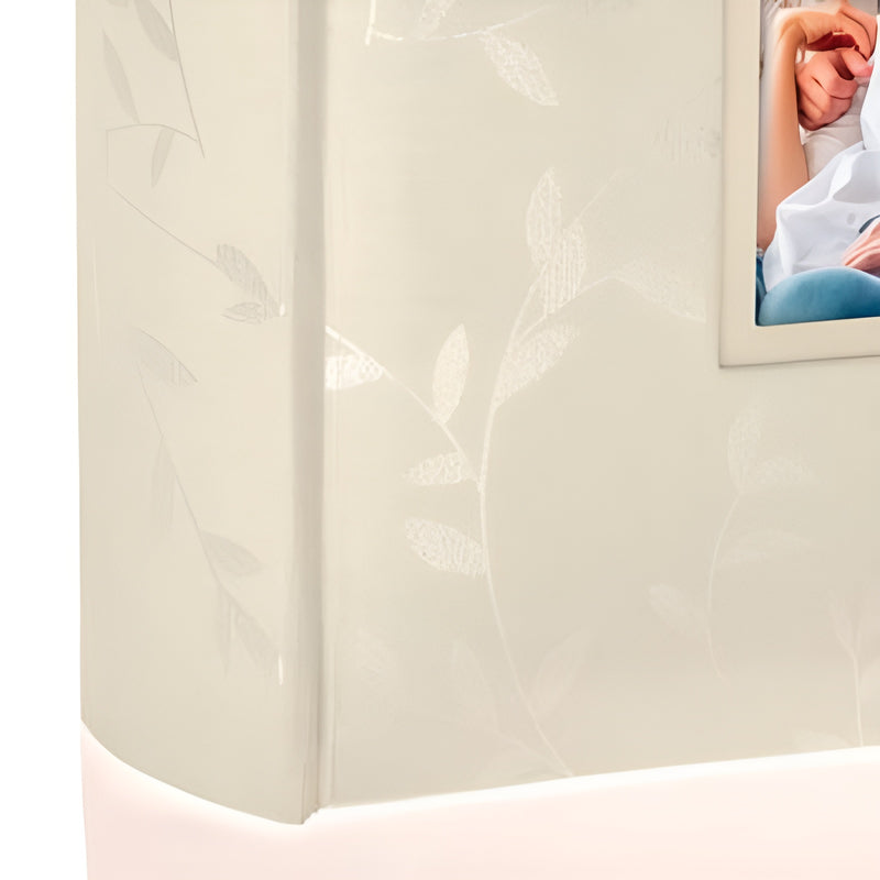 A cream ZEP photo album adorned with an image of a couple, representing love and treasured memories.