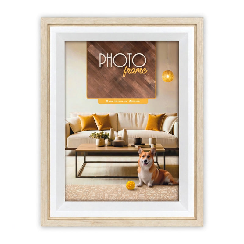 A light natural wood ZEP picture frame with a white mat, showcasing a mockup of a framed photo print. The inner photo features a cozy living room scene with a beige sofa, yellow pillows, a coffee table, and a corgi dog, with a mock text overlay reading 'PHOTO frame'.