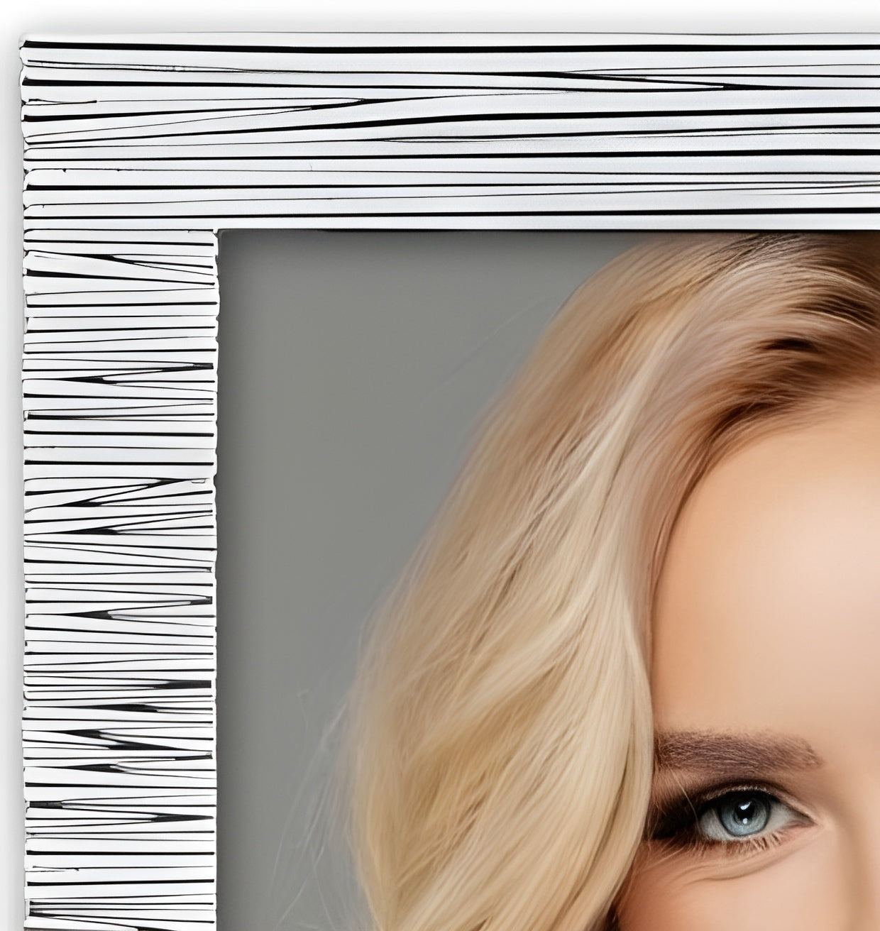 A smiling blonde woman displayed in a stylish white ZEP metal photo frame, radiating beauty and joy.