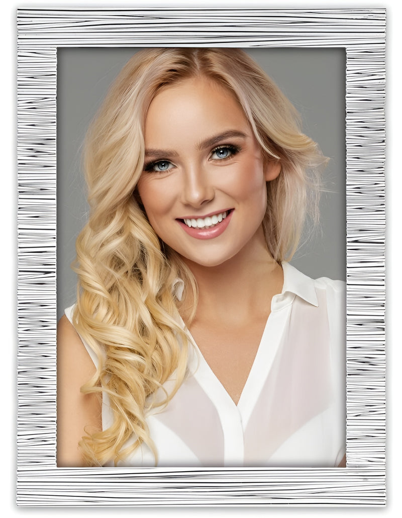 A smiling blonde woman displayed in a stylish white ZEP metal photo frame, radiating beauty and joy.