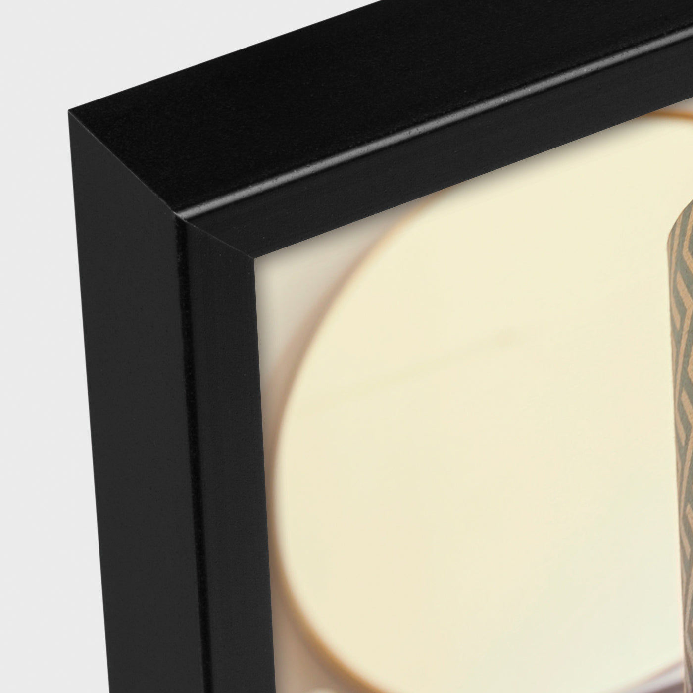 Close-up of a black framed ZEP picture with a light background