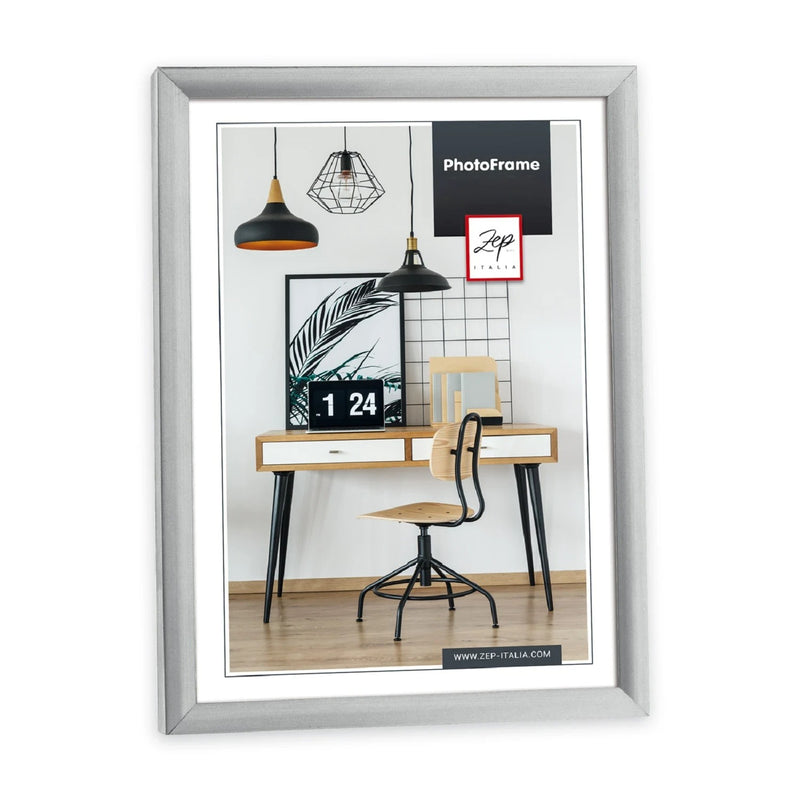 A silver Zep basic photo frame showing a frame on a desk, accompanied by a chair, illustrating a neat and organized work area.